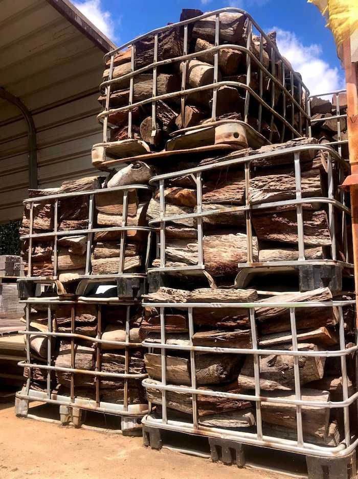 A Pile of Logs Stacked on Top of Each Other on Pallets — Highfields Landscape Supplies In Highfields, QLD