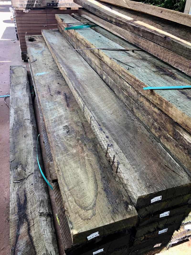 A Stack of Wooden Boards Sitting on Top of Each Other on a Table — Highfields Landscape Supplies In Meringandan, QLD