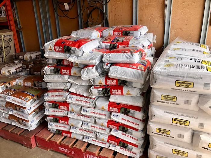 A Bunch of Bags Are Stacked on Top of Each Other in a Warehouse — Highfields Landscape Supplies In Highfields, QLD