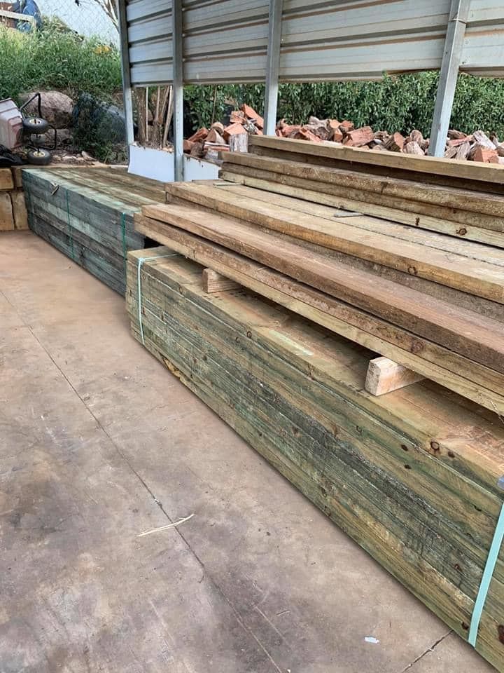 A Warehouse Filled With Lots of Wooden Boards and Bricks — Highfields Landscape Supplies In Meringandan, QLD