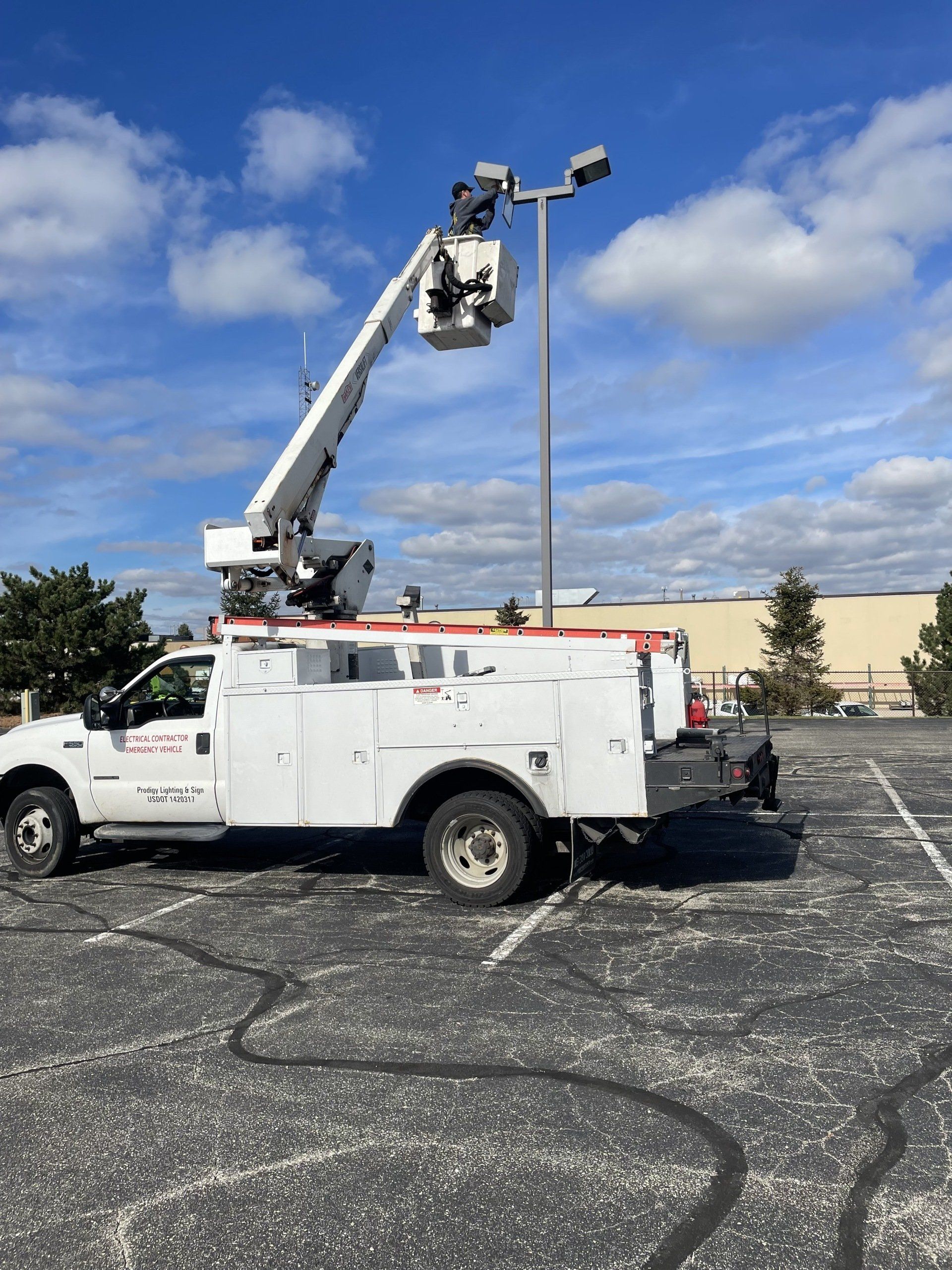 Red Car and Store — Kenosha, WI — Prodigy Lighting & Sign