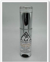 Silver and white AMA Collagen Boost Repair Cream bottle on a white background.