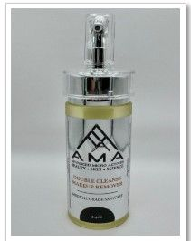 Clear bottle of AMA Double Cleanse Makeup Remover with a pump on a white background.