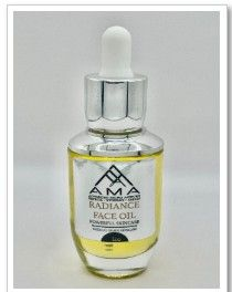 Bottle of face oil with a silver dropper, product name 