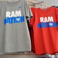 Two T-shirts on display, gray and red, both reading “RAM NATION” in white and blue.