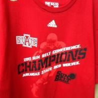 Red Arkansas State Red Wolves 2012 Sun Belt Conference champions T-shirt with white and black text.