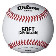 White Wilson softball with red stitching and 