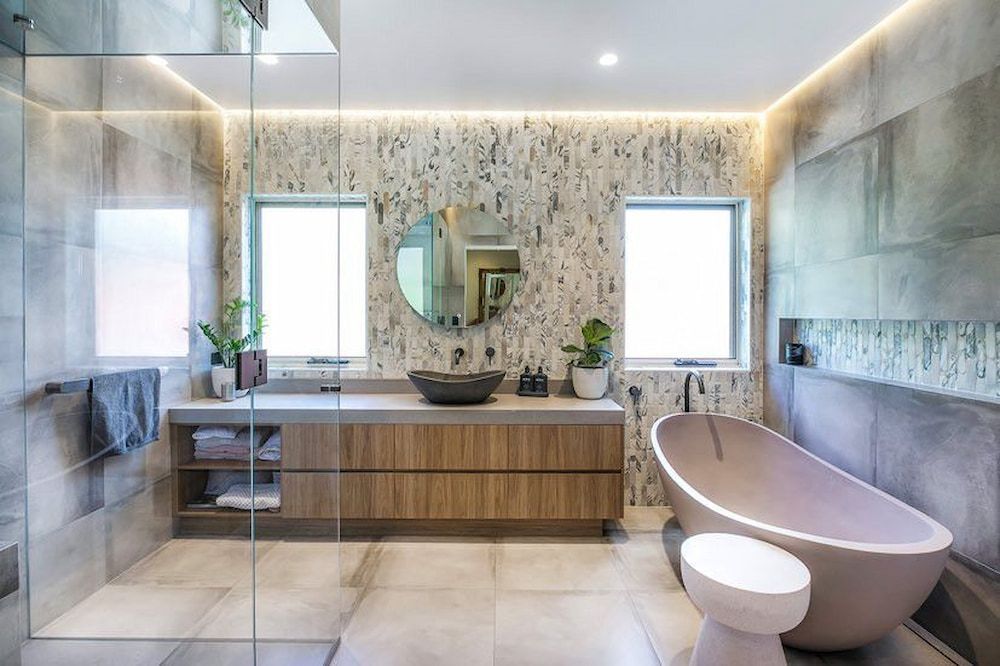 A Bathroom With A Bathtub, Sink, Mirror And Walk In Shower — Matt Loder Constructions in Bulli, NSW