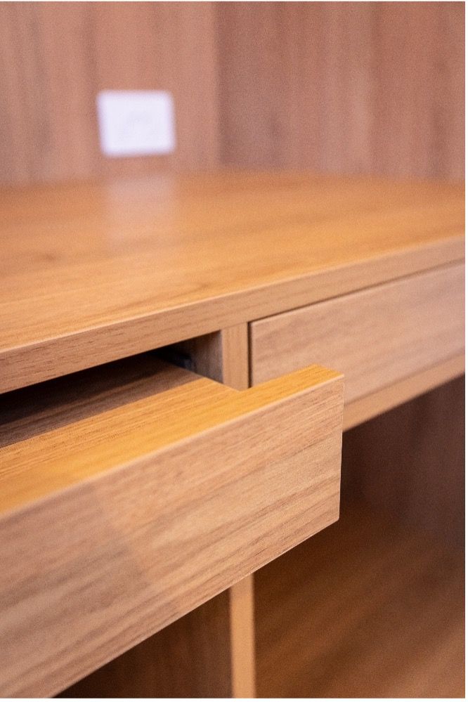 A close up of a wooden desk with a drawer open. — Matt Loder Constructions in Thirroul, NSW