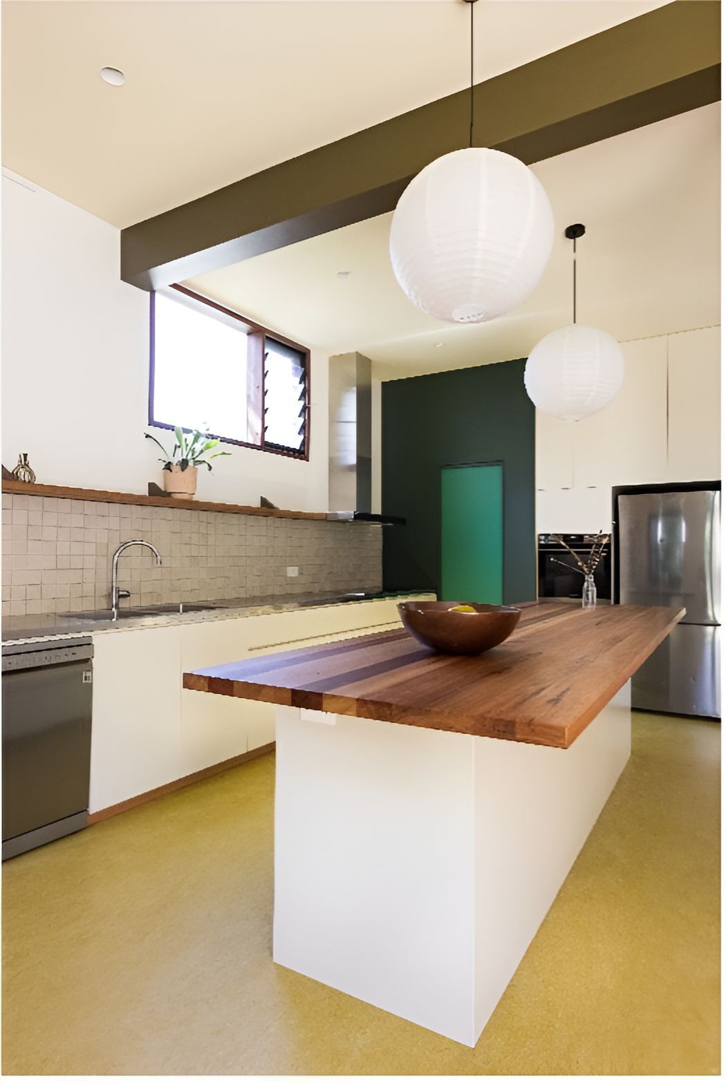 A Kitchen With a Wooden Table and a Bowl on It — Matt Loder Constructions in Bulli, NSW
