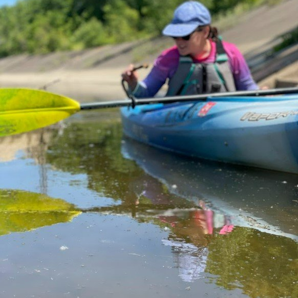 FRWC interim executive director, Sarah Scheitler, investigates following the June 15th chemical spill on the Flint River
