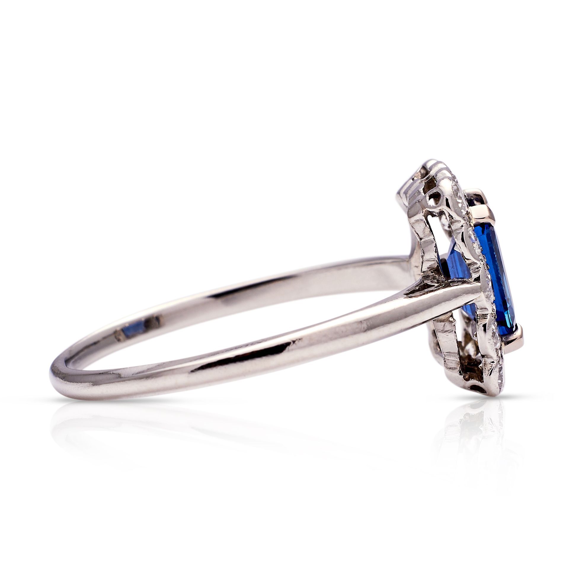 a silver ring with a blue stone in the center