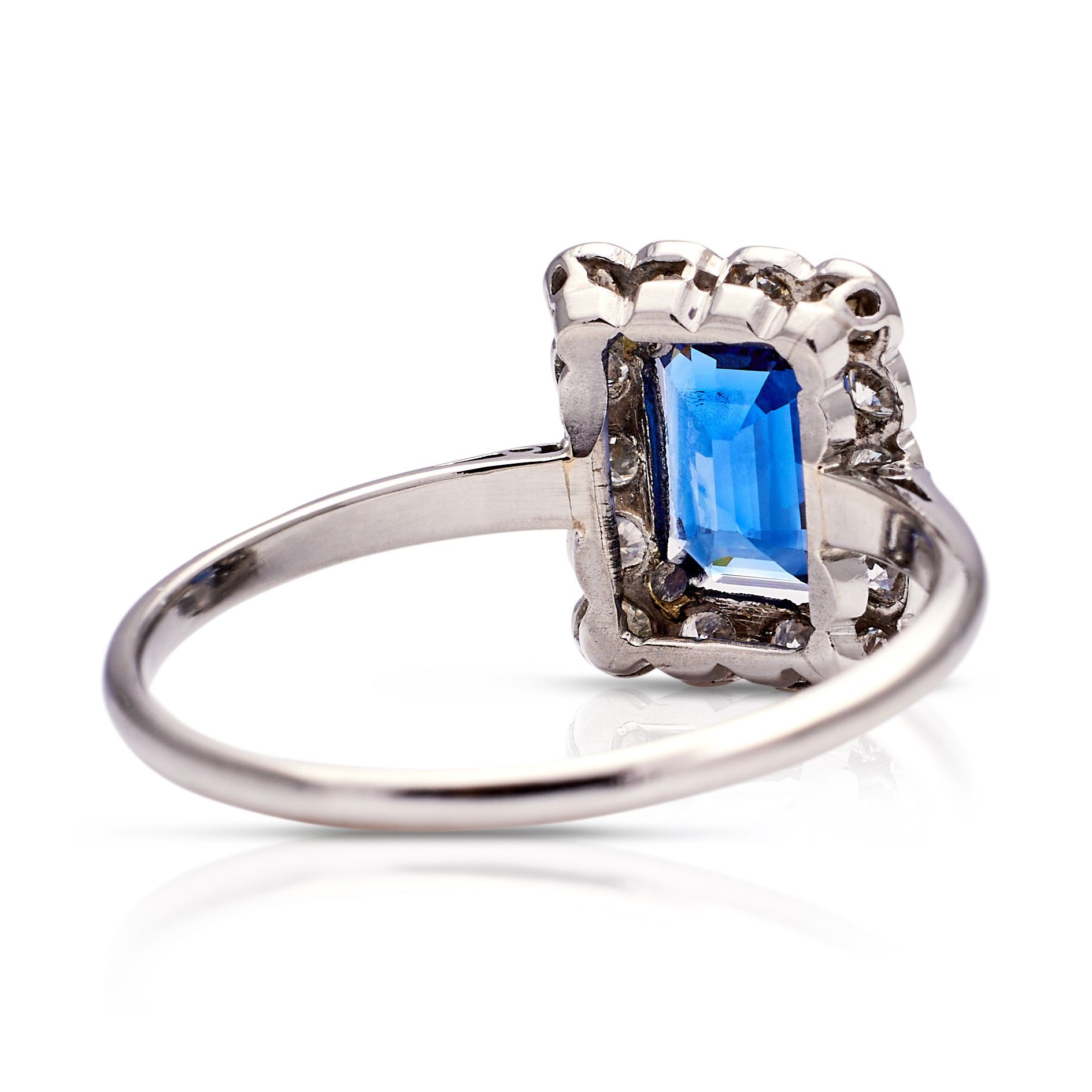 a silver ring with a blue stone in the center