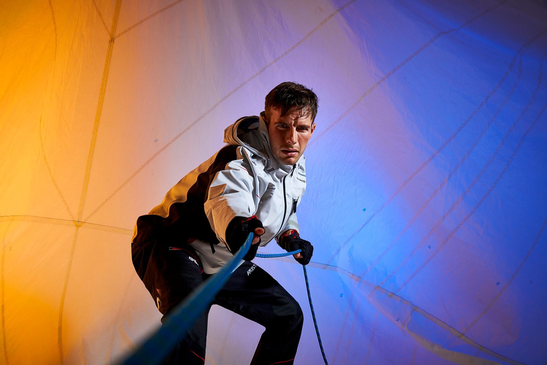 a man is holding a rope in a room .