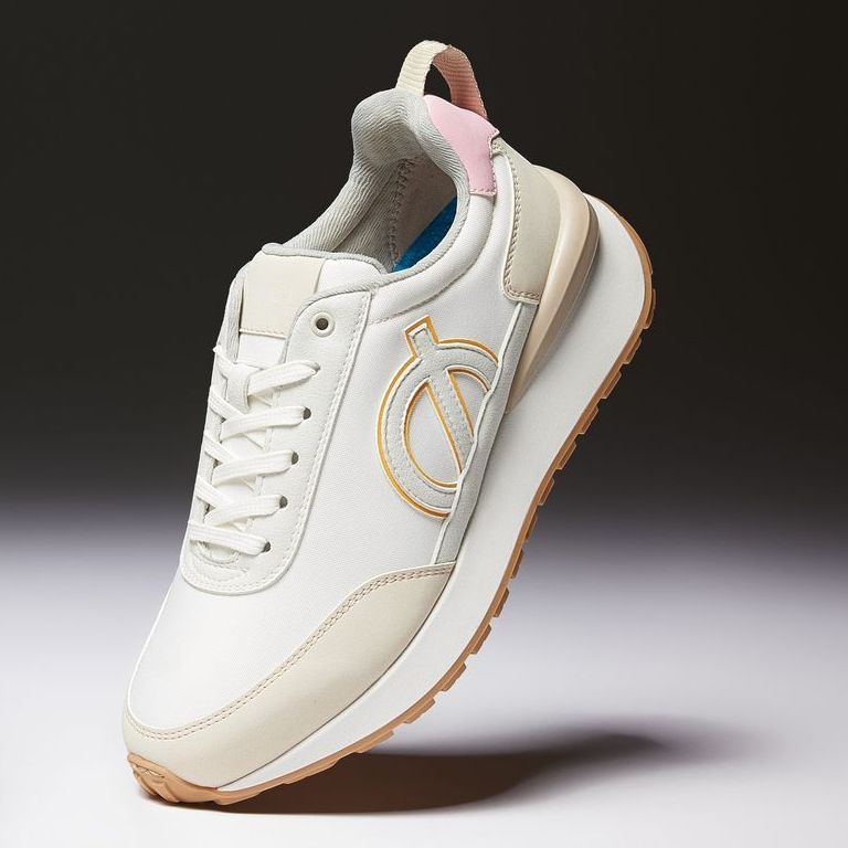 a pair of white sneakers with a pink stripe on the side