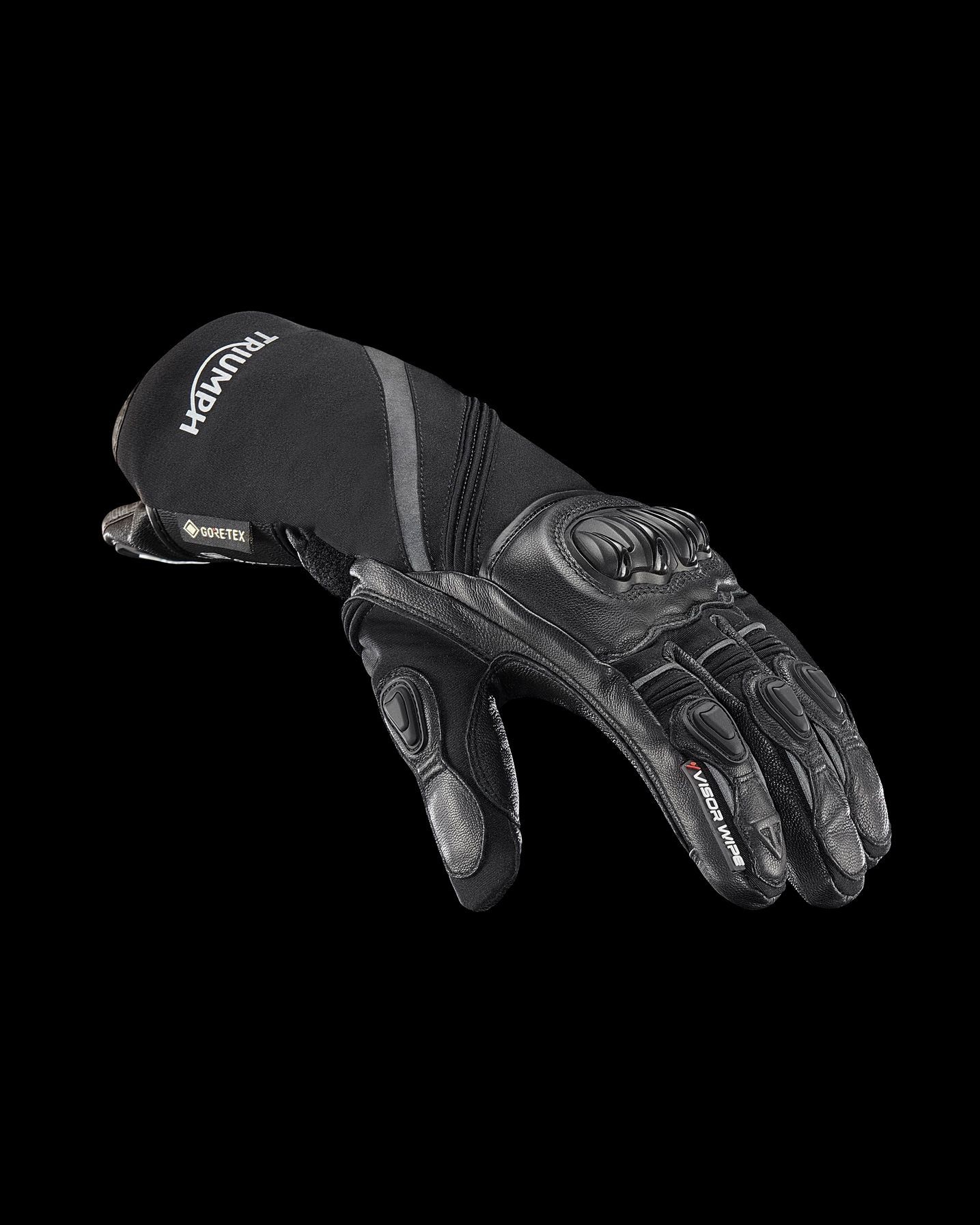 a pair of black gloves on a black background .