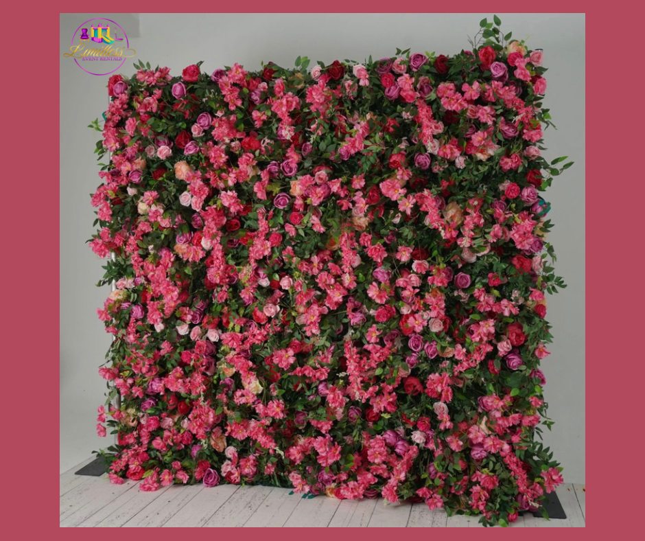 A wall of pink flowers and green leaves