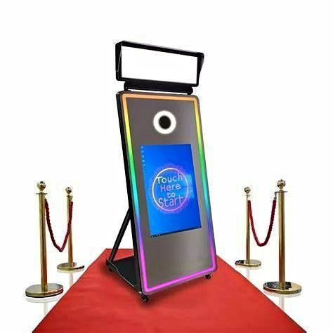 A photo booth is sitting on top of a red carpet.