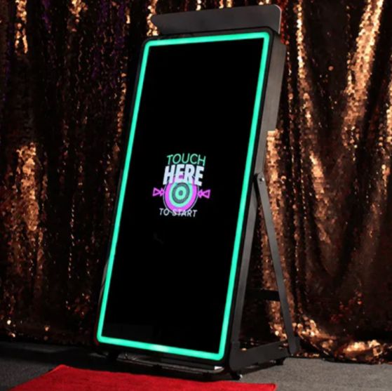 A mirror that says touch here on it
