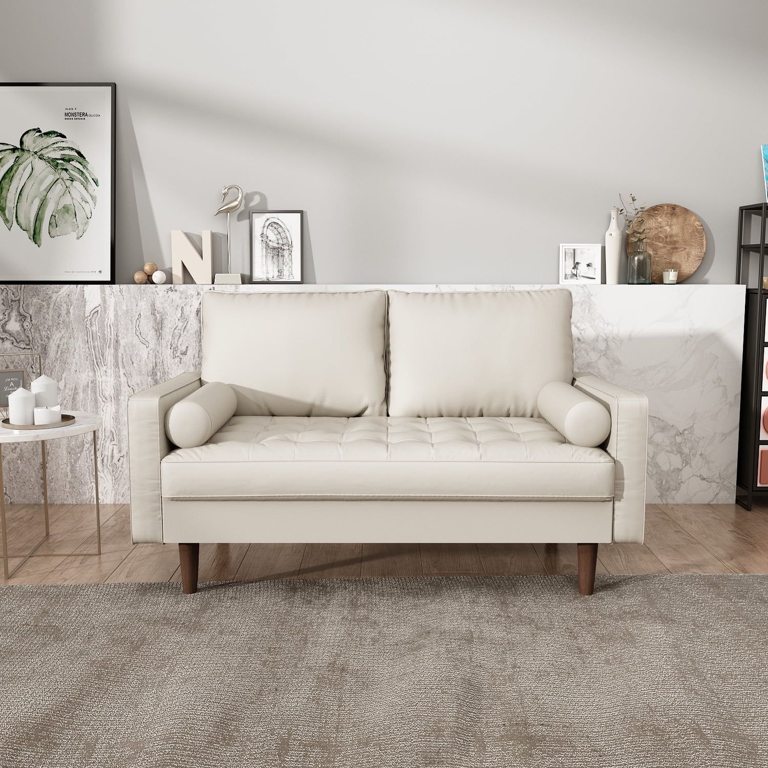 A white couch is sitting on a rug in a living room.