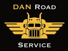 Dan Road Service logo with gold truck and wings on black background