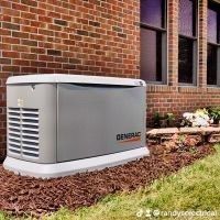 A generator is sitting on the side of a brick building.