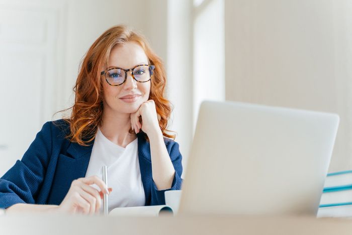 Woman With Her Laptop — Jodie Nielsen Cost Segregation Service, Inc. — Nationwide Woman With Her Laptop — Jodie Nielsen Cost Segregation Service, Inc. — Nationwide