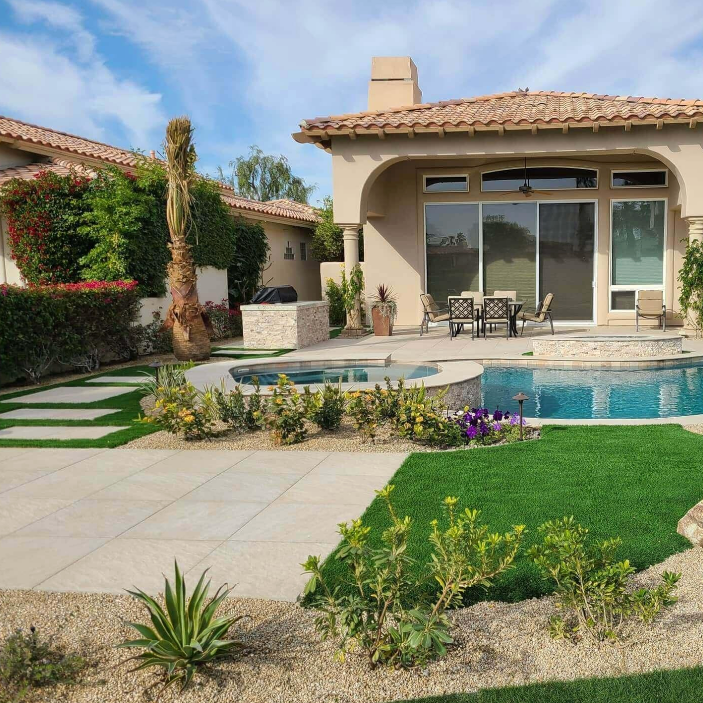 A house with a swimming pool in front of it
