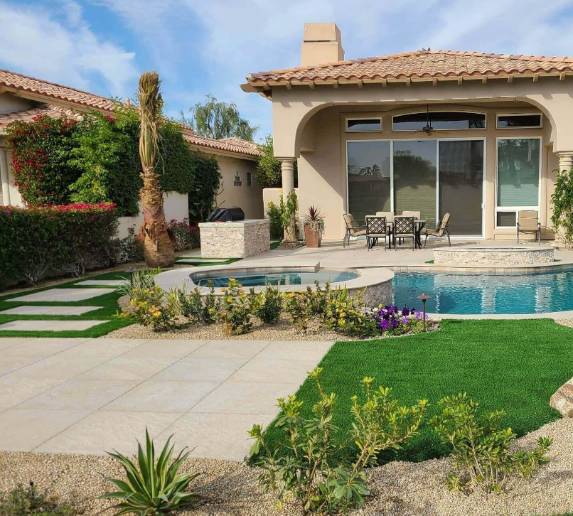 A house with a swimming pool and a patio area