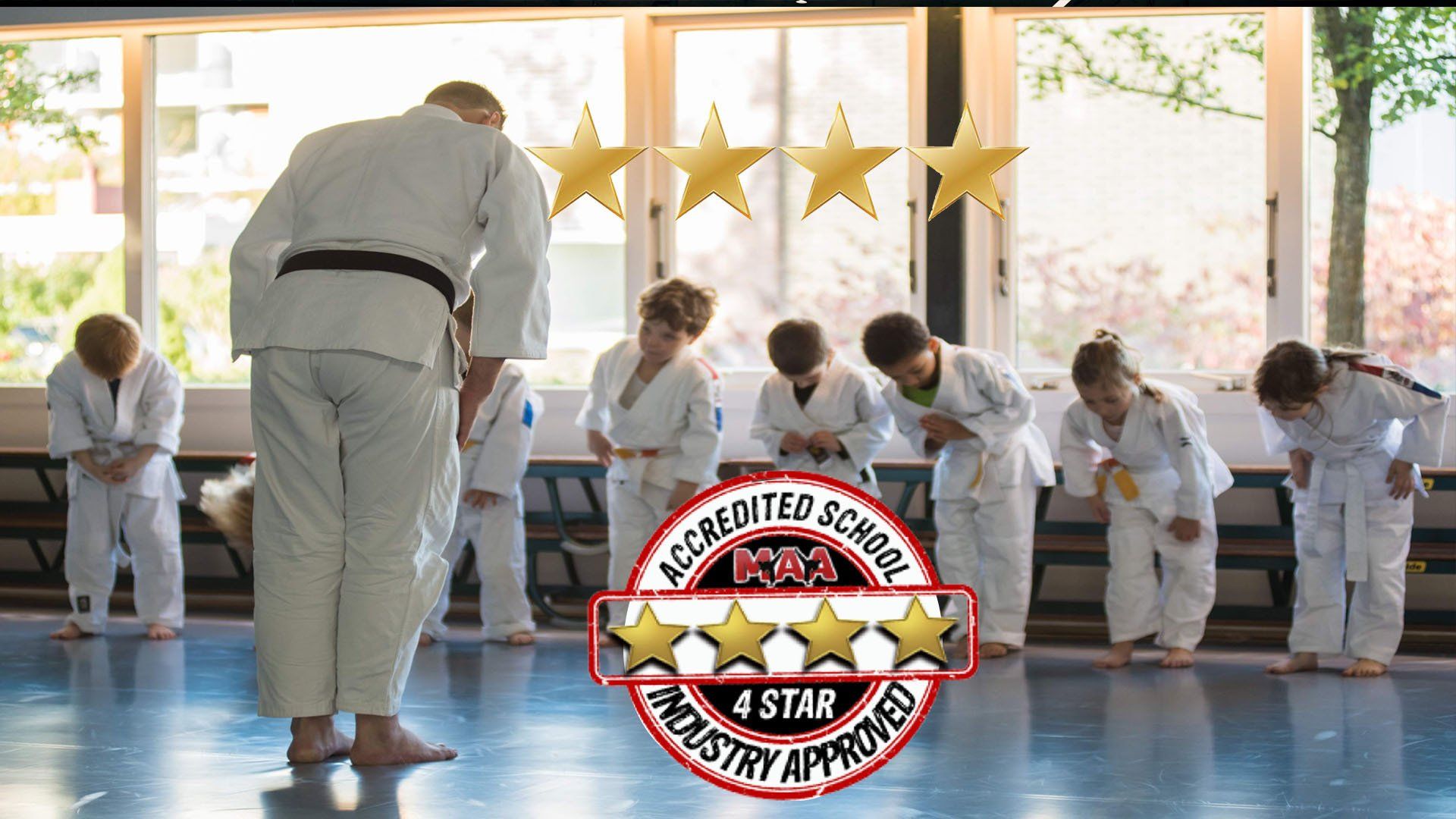 A group of people are practicing judo in a gym.