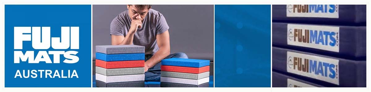 A man is standing next to a stack of fuji mats australia