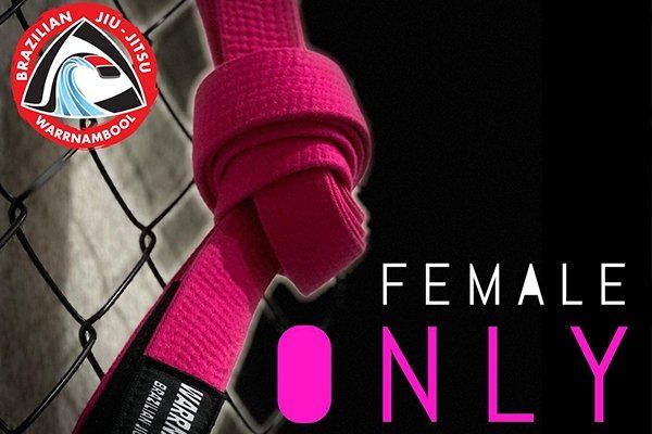A pink belt that says female only on it