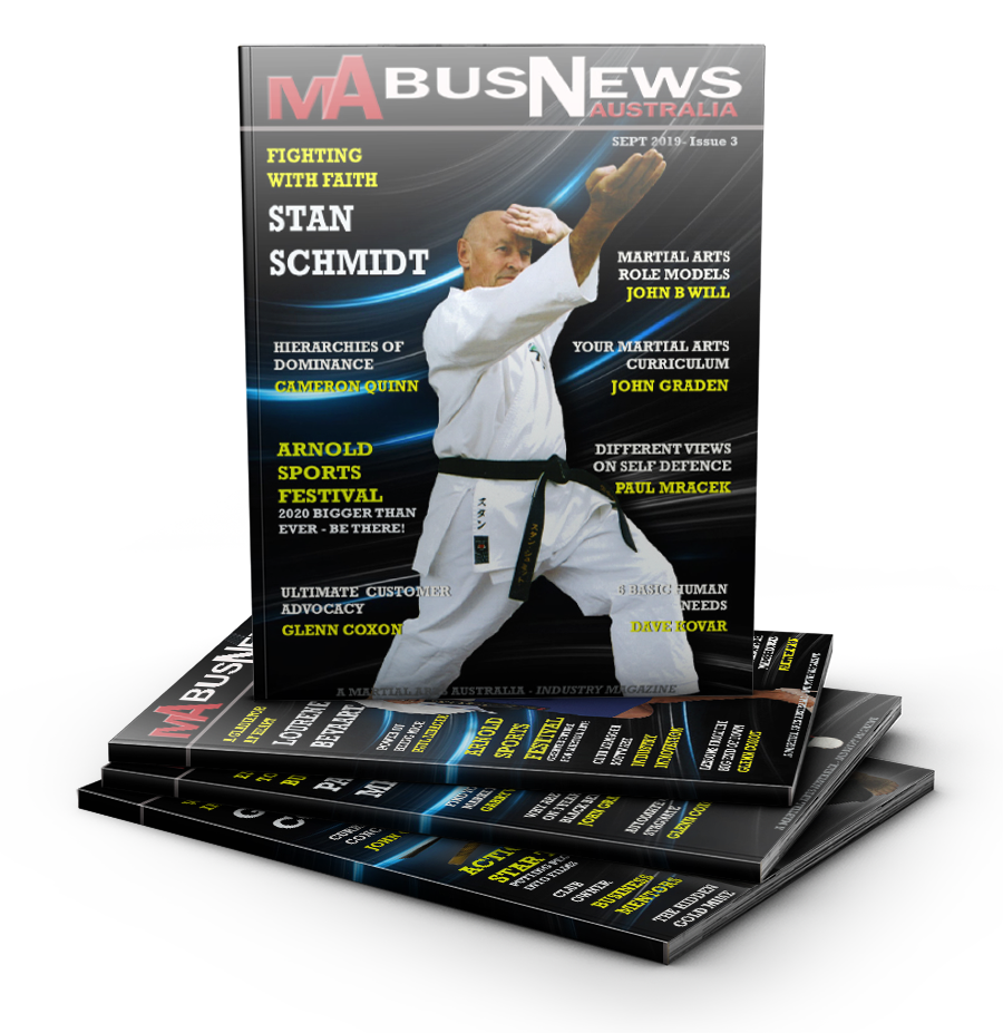A man in a karate uniform is on the cover of a magazine