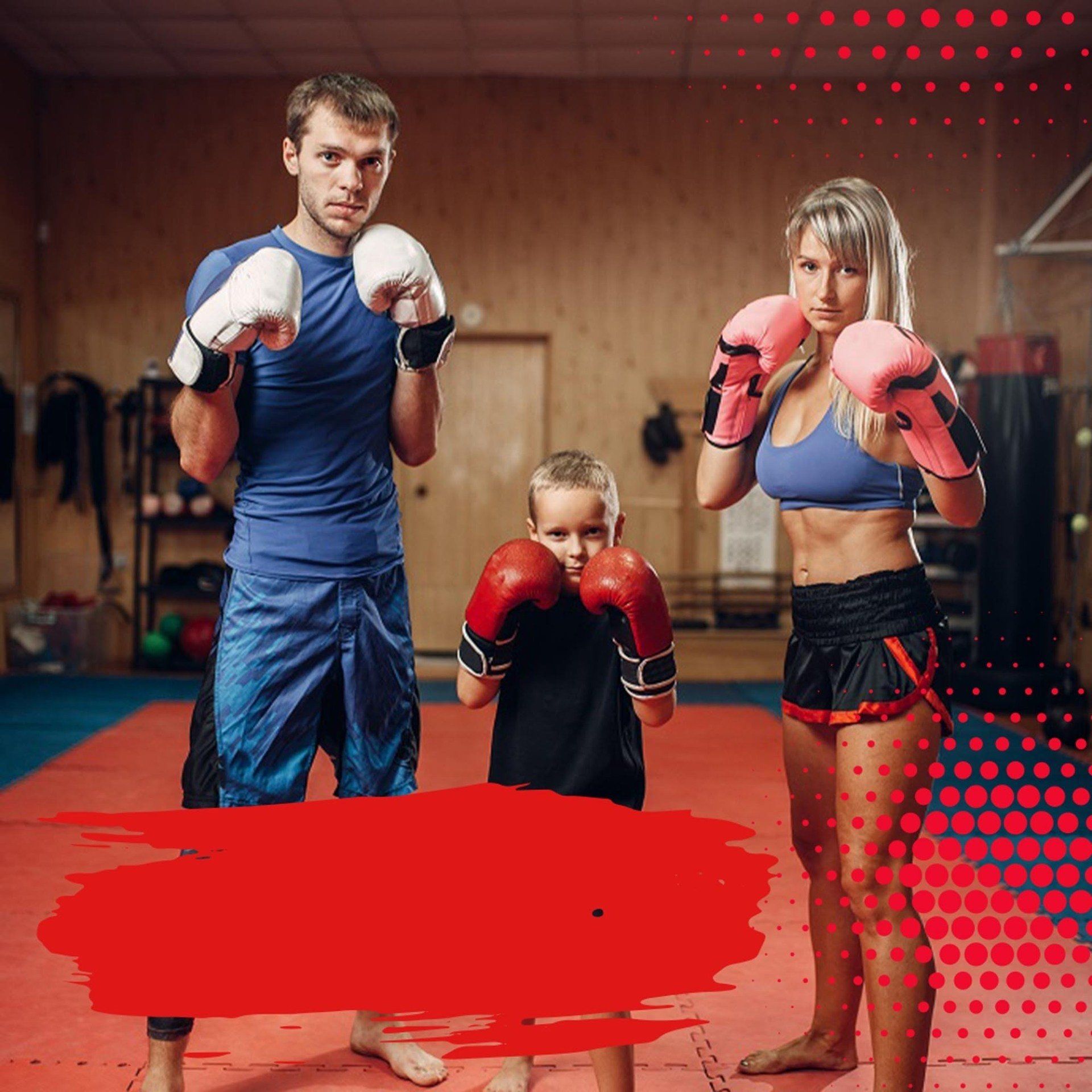 A man , a woman and a child are boxing in a gym.