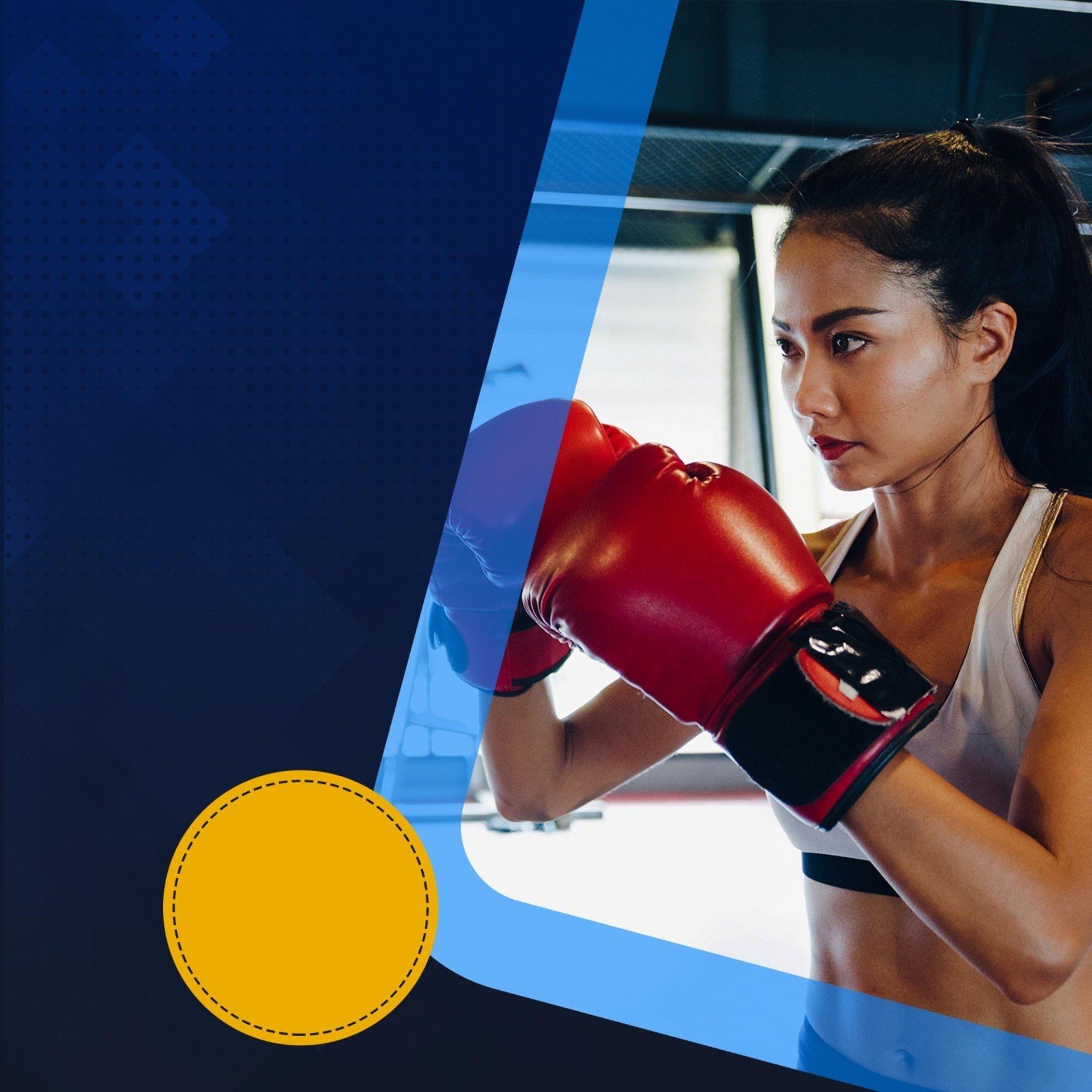 A woman is wearing red boxing gloves in a gym.