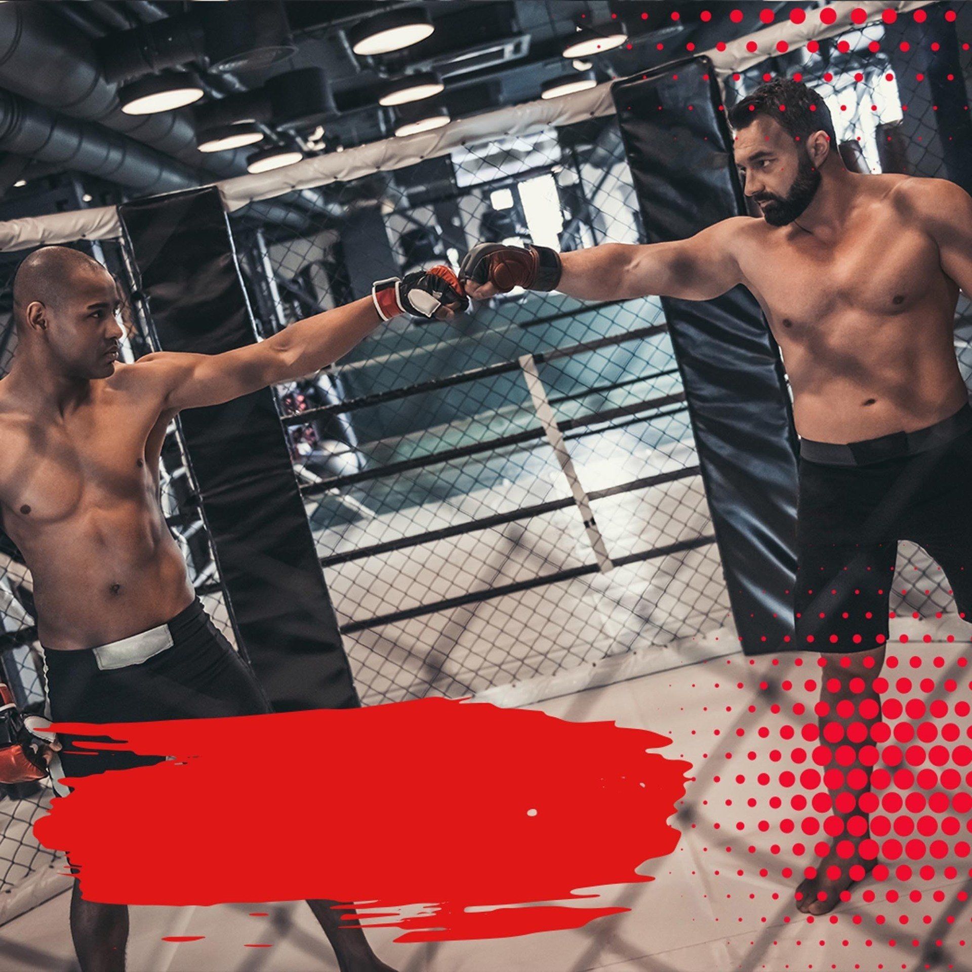 Two men are boxing in a ring in a gym.