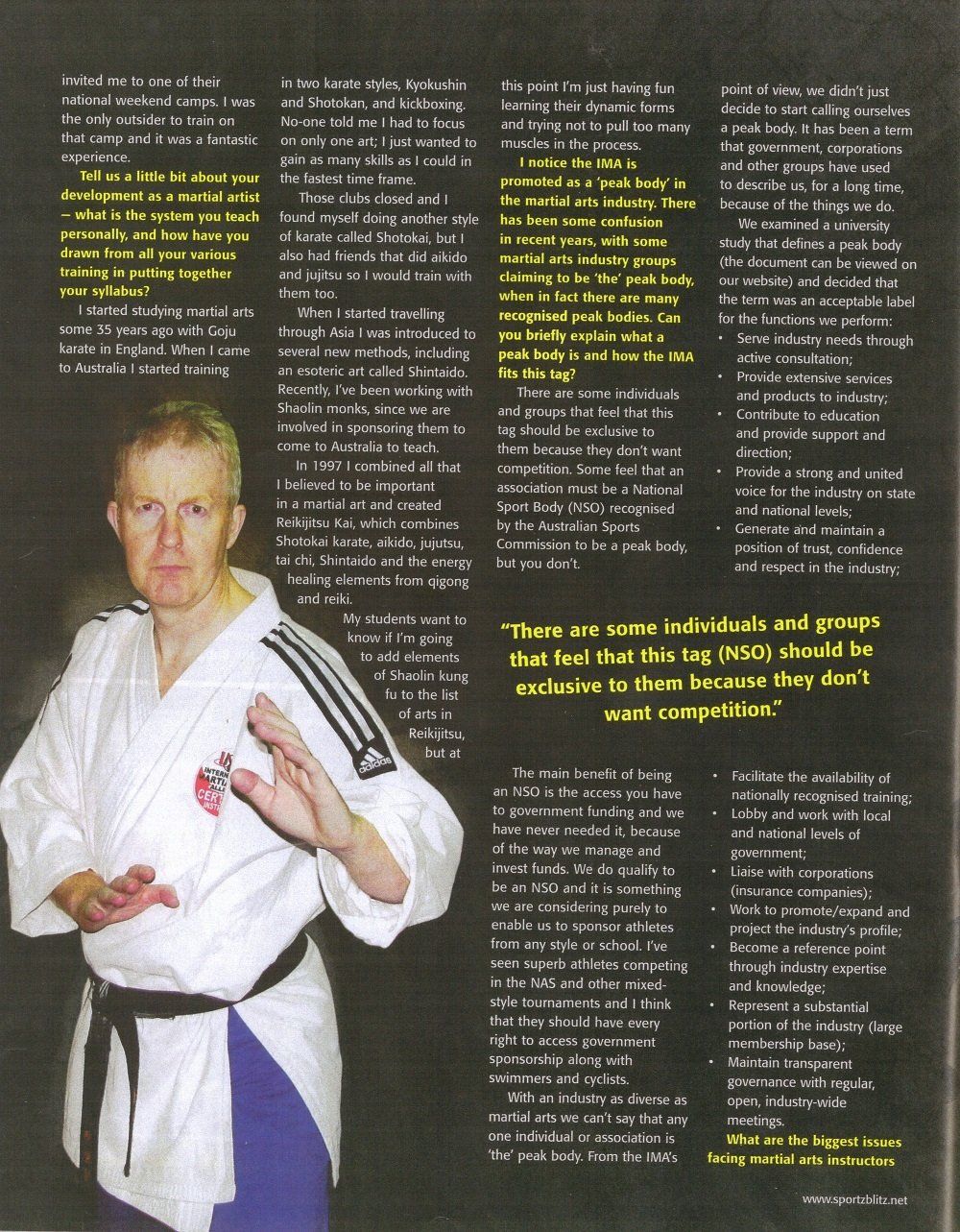 A man in a white karate uniform with a black belt