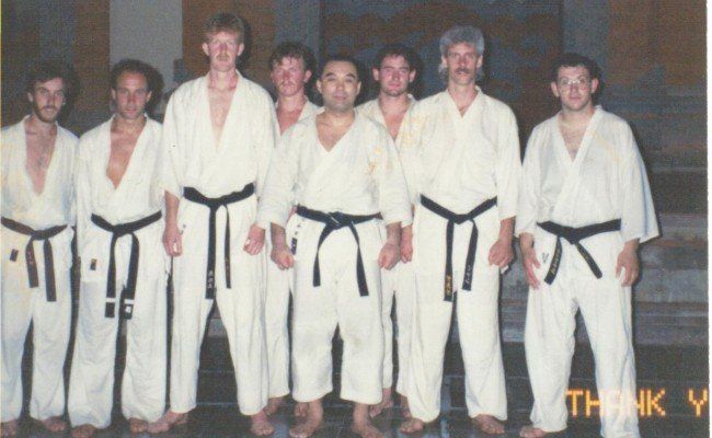 A group of karate fighters are posing for a photo and the caption says thank you