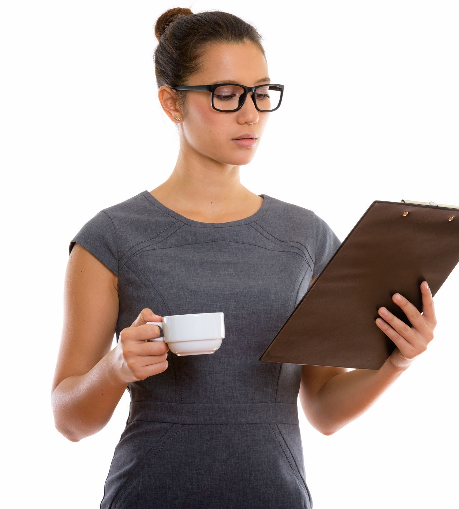 A woman holding a cup of coffee and a clipboard