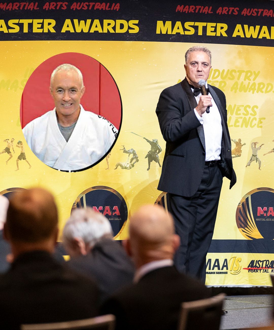 A man in a tuxedo is giving a speech at the martial arts australia master awards