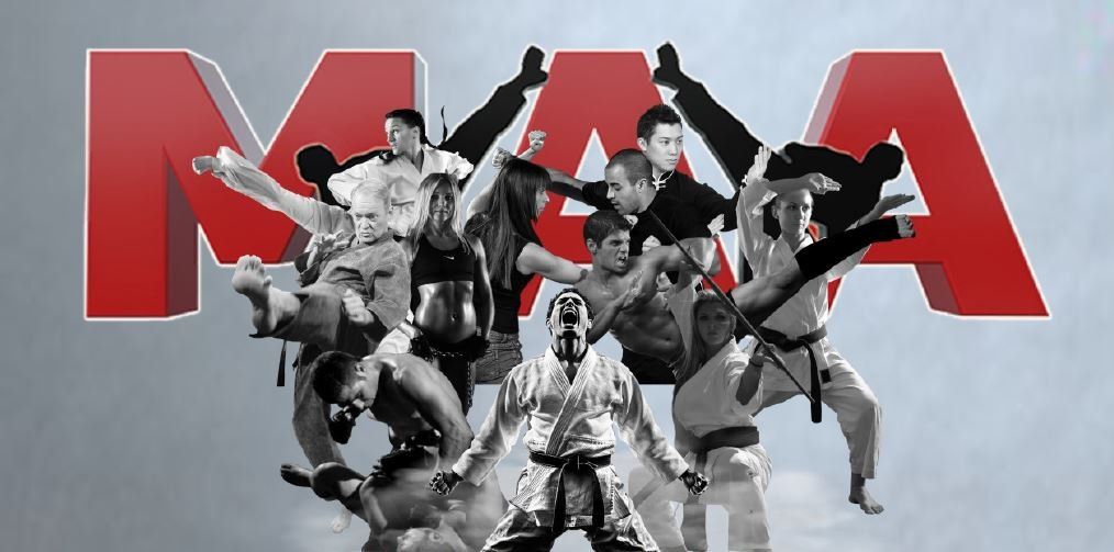 A group of people are standing in front of the word mma.