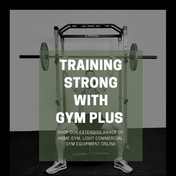 A man is lifting a barbell in a squat rack.