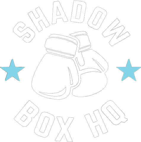 A pair of boxing gloves with the words `` shadow box hq '' written around them.