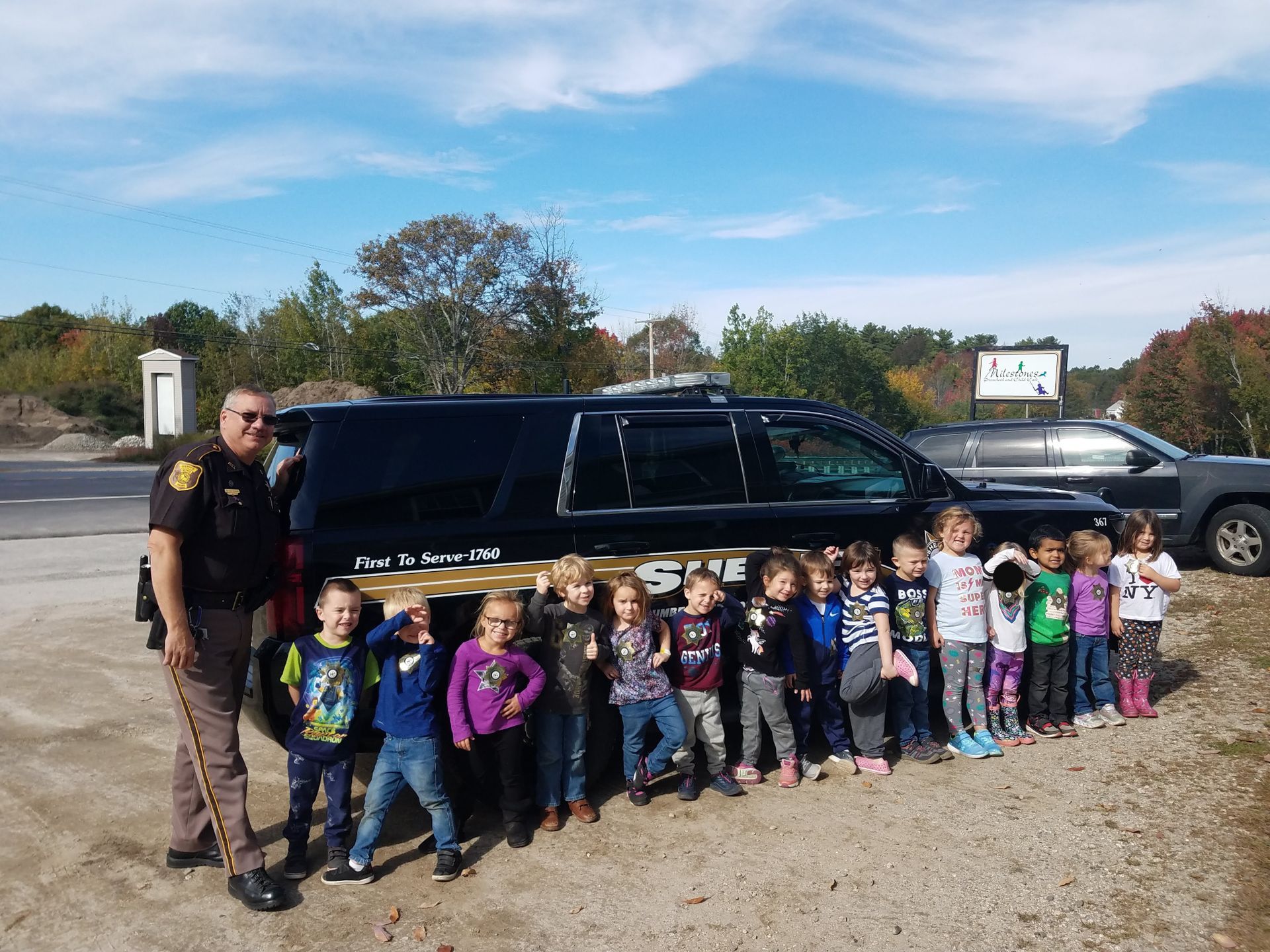 sheriff and children on the car pictorial sheriff and children on the car pictorial