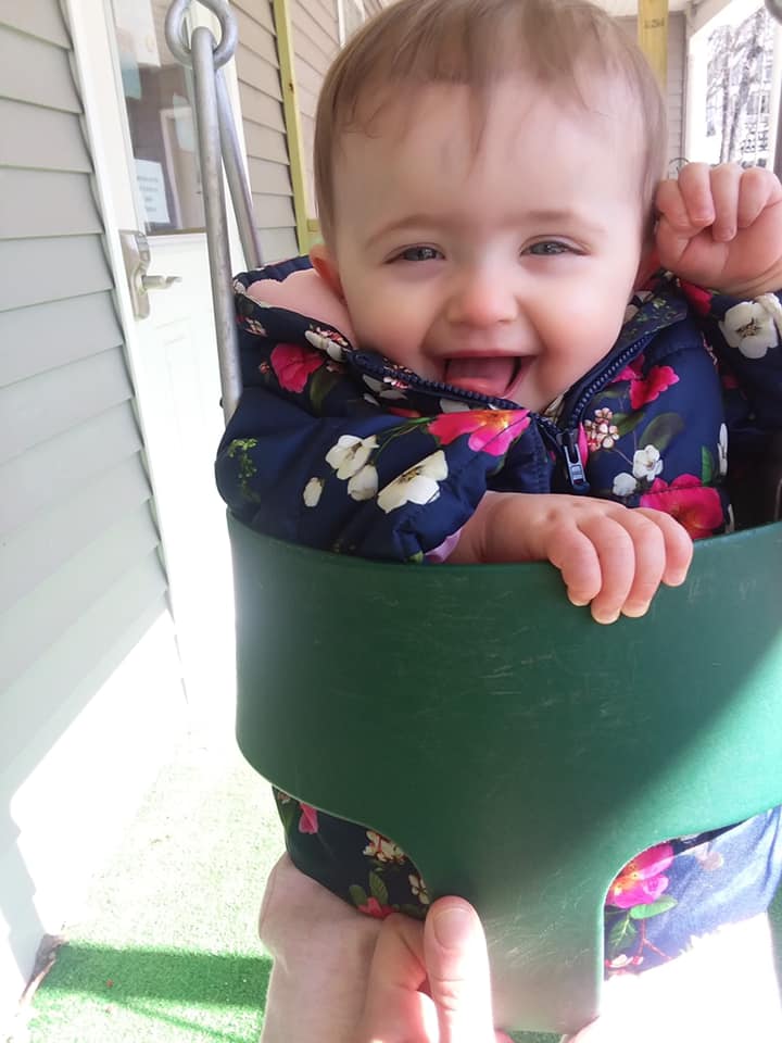 smiling babies on the swing