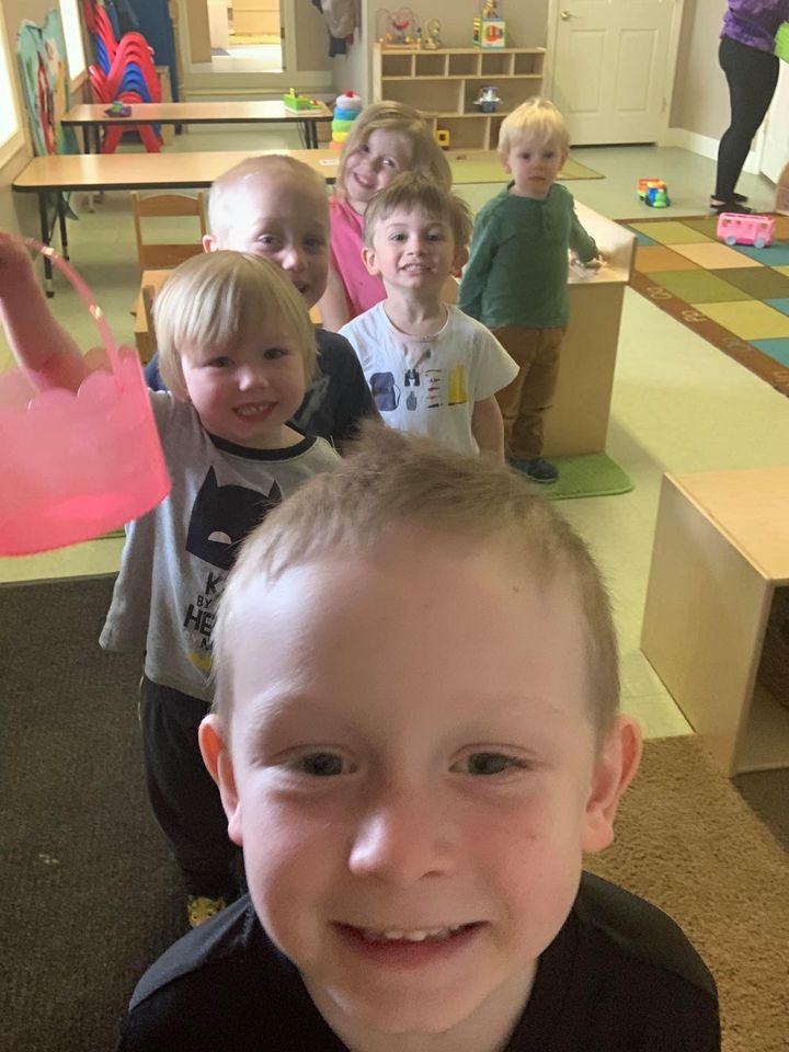 toddler line up smilling