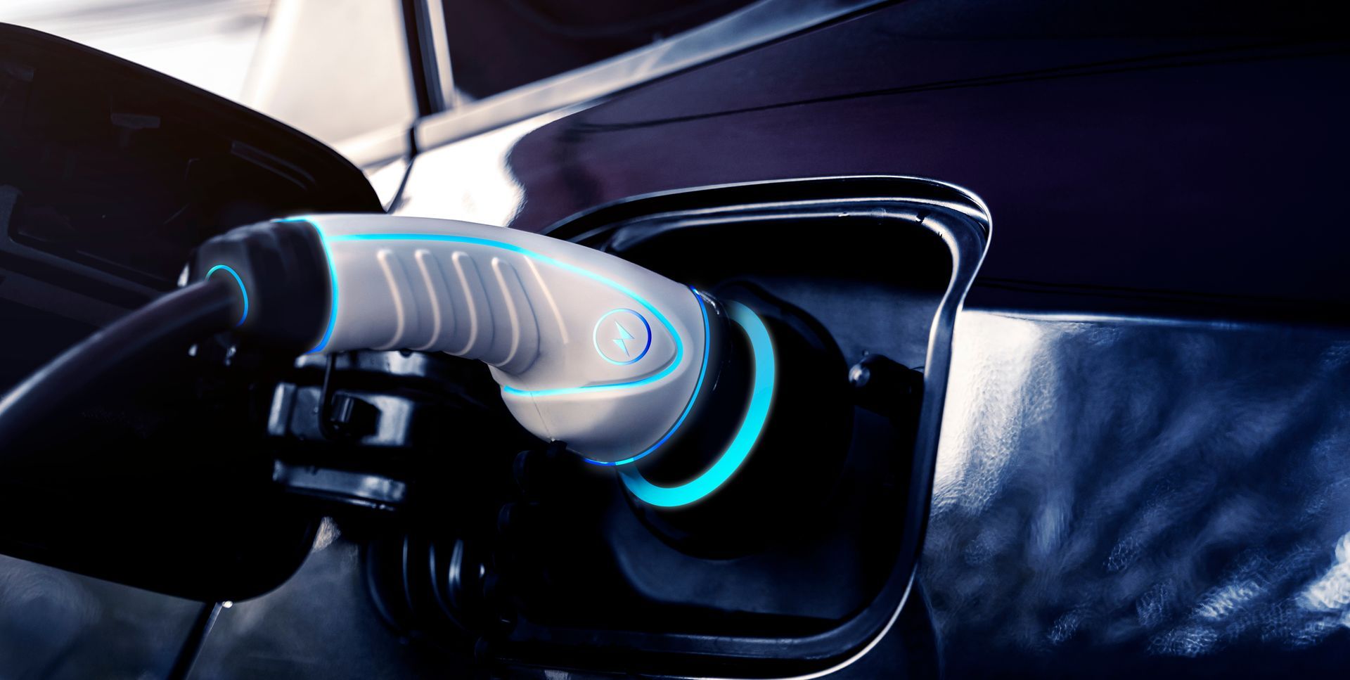 A White Electric Vehicle Charging Plug Inserted Into the Charging Port — Cool Cars NT in Anula, NT