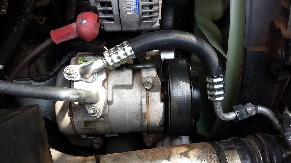 Car Engine Compartment With Ac Compressor and Hoses — Cool Cars NT in Anula, NT