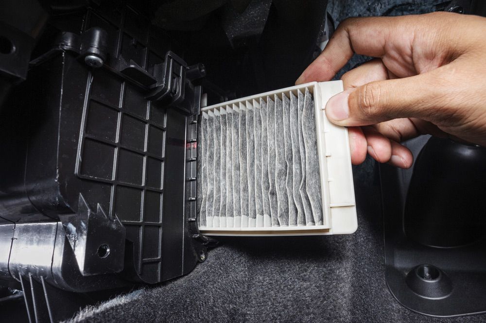 Person Removing a Dirty Cabin Air Filter — Cool Cars NT in Anula, NT