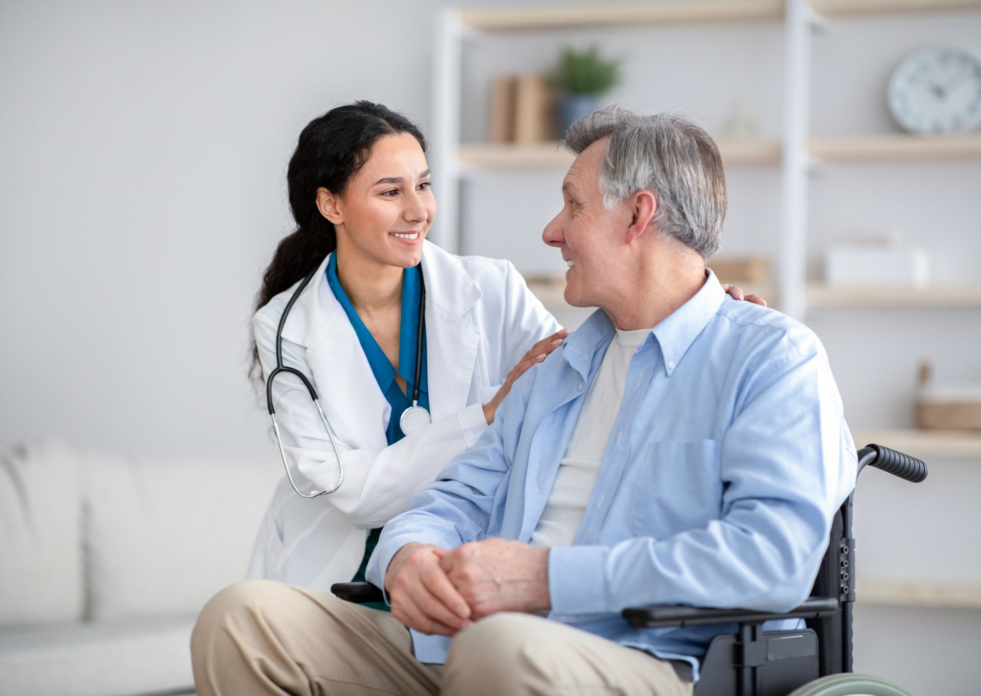 Nurse providing care to an elderly man in a wheelchair, highlighting home health care service. Nurse providing care to an elderly man in a wheelchair, highlighting home health care service.